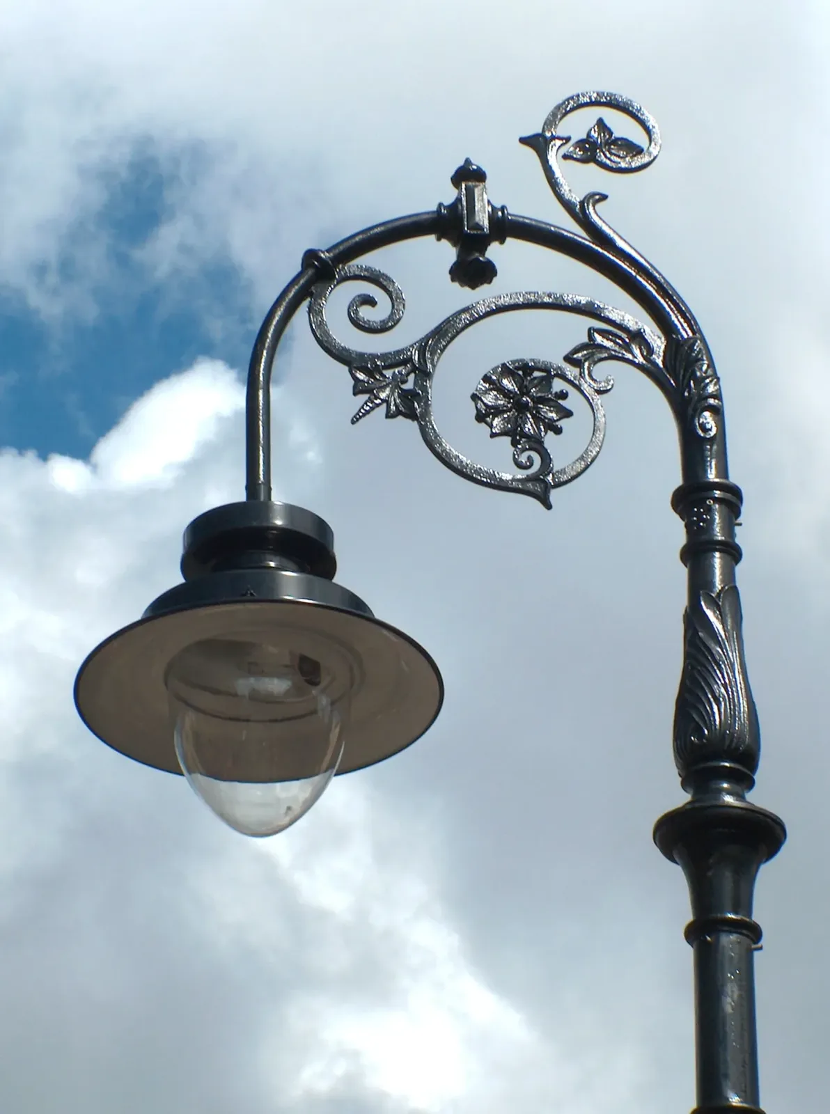 Ornate cast iron lamp bracket